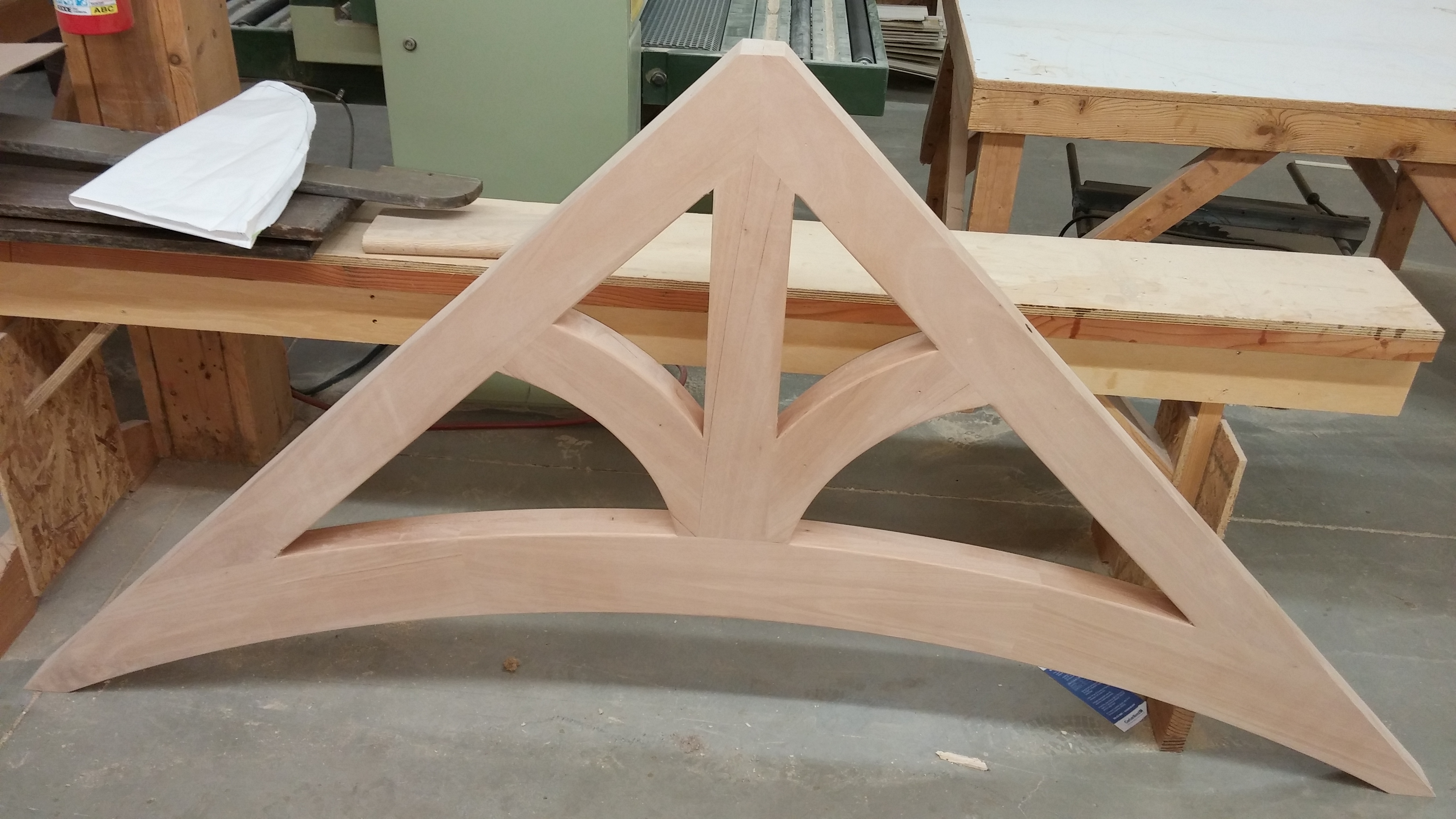 Solid wood arched bracket for dormer